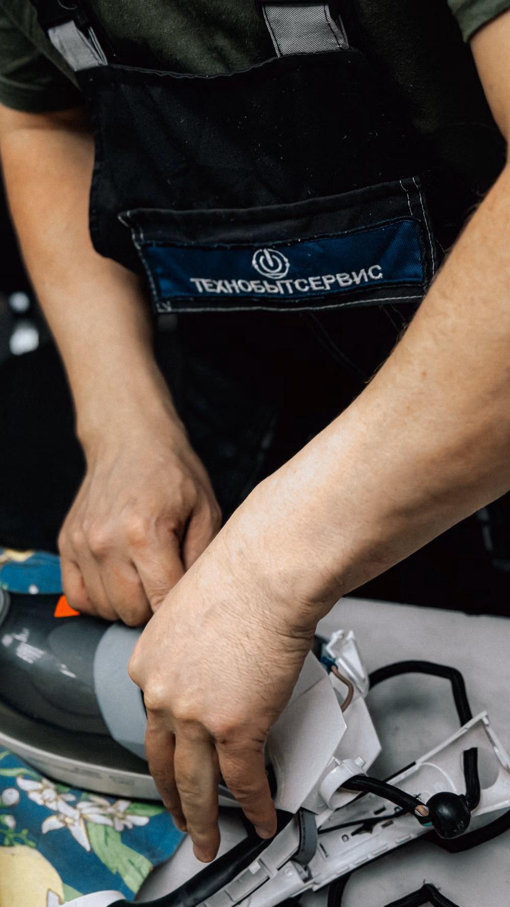 Technician working on an appliance repair task